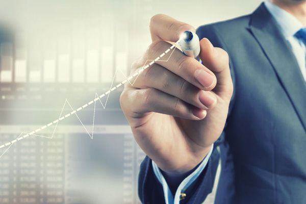 Businessman hand drawing increasing graph on media screen